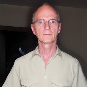 Balding man wearing glasses